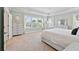 Large bedroom features tray ceilings, natural light, and light blue accent walls at 1536 Keshi Pearl Dr, Mount Pleasant, SC 29466