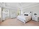 Comfortable bedroom featuring neutral decor, tray ceilings, and lots of natural light at 1536 Keshi Pearl Dr, Mount Pleasant, SC 29466