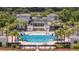Stunning resort-style pool area with palm trees, lounge chairs, and plenty of space to relax at 1536 Keshi Pearl Dr, Mount Pleasant, SC 29466