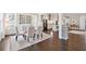 Open concept dining area flows seamlessly into a modern kitchen with stainless steel appliances at 1536 Keshi Pearl Dr, Mount Pleasant, SC 29466