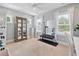 Bright exercise room features a ceiling fan, windows, and workout equipment at 1536 Keshi Pearl Dr, Mount Pleasant, SC 29466