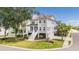 Charming gray two-story home with inviting front porch, lush landscaping and a corner lot location at 1536 Keshi Pearl Dr, Mount Pleasant, SC 29466