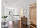 Hallway with wood floors, decorative furniture and an open doorway to a bathroom at 1536 Keshi Pearl Dr, Mount Pleasant, SC 29466