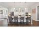 Kitchen island featuring modern pendant lighting, white cabinets, and seating for four at 1536 Keshi Pearl Dr, Mount Pleasant, SC 29466