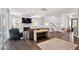 This bright living room boasts a cozy fireplace, a ceiling fan, and stylish furniture at 1536 Keshi Pearl Dr, Mount Pleasant, SC 29466