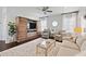 Comfortable living room has a large entertainment center and plush seating; perfect for Gathering movie nights and gatherings at 1536 Keshi Pearl Dr, Mount Pleasant, SC 29466