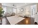Bright living room features hardwood floors, neutral furniture, and stylish décor; an inviting space to relax and entertain at 1536 Keshi Pearl Dr, Mount Pleasant, SC 29466