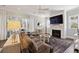 Living room featuring a modern fireplace, large windows, and comfortable seating with access to the outdoors at 1536 Keshi Pearl Dr, Mount Pleasant, SC 29466