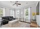 Comfortable living room with ample natural light, stylish furnishings, and neutral decor at 1536 Keshi Pearl Dr, Mount Pleasant, SC 29466