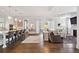 Open-concept living space with stylish seating, a fireplace, and access to the kitchen area at 1536 Keshi Pearl Dr, Mount Pleasant, SC 29466
