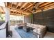 Spacious covered outdoor patio with generous seating, ceiling fans, and a stylish outdoor rug at 1536 Keshi Pearl Dr, Mount Pleasant, SC 29466