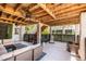Inviting covered outdoor patio with comfortable seating and a ceiling fan for warm days at 1536 Keshi Pearl Dr, Mount Pleasant, SC 29466