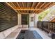 Serene outdoor patio featuring a comfortable sectional, ceiling fan, and access to stairs at 1536 Keshi Pearl Dr, Mount Pleasant, SC 29466