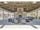 Community pavilion featuring comfortable seating, picnic tables, and a cozy brick fireplace at 1536 Keshi Pearl Dr, Mount Pleasant, SC 29466
