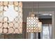 Detailed shot of pendant lights showcasing their unique design and illuminating the kitchen space at 1536 Keshi Pearl Dr, Mount Pleasant, SC 29466