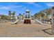 Community playground featuring a wooden playset with slides and a tower, set against a blue sky at 1536 Keshi Pearl Dr, Mount Pleasant, SC 29466