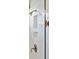 Close-up of shower showcasing niche shelving and updated shower head fixture at 1536 Keshi Pearl Dr, Mount Pleasant, SC 29466