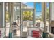 Relaxing sunroom with comfortable seating, airy curtains, and views of the surrounding landscape at 1536 Keshi Pearl Dr, Mount Pleasant, SC 29466