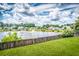 Scenic backyard view overlooking a serene lake with a charming fountain feature enhancing the community's appeal at 170 Highwoods Plantation Ave, Summerville, SC 29485