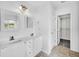 Bathroom with a double sink vanity, framed mirrors, and a closet at 170 Highwoods Plantation Ave, Summerville, SC 29485