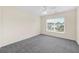 Comfortable bedroom featuring neutral walls, carpeting, and a sunny window view at 170 Highwoods Plantation Ave, Summerville, SC 29485