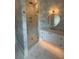 Bathroom featuring new wallpaper, glass shower, and updated vanity at 1727 Atlantic Ave, Sullivans Island, SC 29482