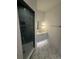 Modern bathroom featuring a glass enclosed shower, decorative tile floors, and contemporary fixtures at 1727 Atlantic Ave, Sullivans Island, SC 29482