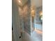 Bathroom showcasing a glass shower, new wallpaper, and an updated vanity at 1727 Atlantic Ave, Sullivans Island, SC 29482