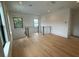 Bonus room with hardwood floors and windows bringing in natural light at 1727 Atlantic Ave, Sullivans Island, SC 29482