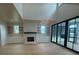 Bright living room features a fireplace and large glass doors to seamlessly blend indoor-outdoor spaces at 1727 Atlantic Ave, Sullivans Island, SC 29482