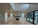 Bright and open living room featuring a fireplace, custom cabinets, and sliding doors at 1727 Atlantic Ave, Sullivans Island, SC 29482