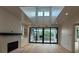 Open concept living room with fireplace, hardwood floors, large sliding doors at 1727 Atlantic Ave, Sullivans Island, SC 29482