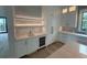 Convenient wet bar featuring marble countertops, custom cabinets, and wine cooler at 1727 Atlantic Ave, Sullivans Island, SC 29482