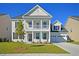Charming two-story home with a well-manicured lawn and a two-car garage at 1816 Nola Run, Summerville, SC 29485