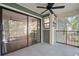 This balcony has a ceiling fan and a sliding glass door overlooking the community at 1872 Montclair Dr # C, Mount Pleasant, SC 29464