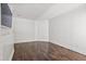 Bedroom featuring wood floors, white walls, and a mounted television at 1872 Montclair Dr # C, Mount Pleasant, SC 29464
