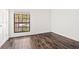 Bedroom with hardwood floors and a large window providing natural light at 1872 Montclair Dr # C, Mount Pleasant, SC 29464