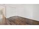 A well-lit bedroom with hardwood floors, white walls, and a closet with folding doors at 1872 Montclair Dr # C, Mount Pleasant, SC 29464
