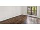 Bedroom featuring pristine white walls, hardwood flooring and a window that provides natural light at 1872 Montclair Dr # C, Mount Pleasant, SC 29464