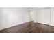 This bedroom features wood flooring, neutral paint, and closet with folding doors at 1872 Montclair Dr # C, Mount Pleasant, SC 29464