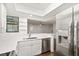 Renovated kitchen with stainless steel appliances, white cabinets, and an open bar at 1872 Montclair Dr # C, Mount Pleasant, SC 29464