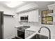 Updated kitchen with stainless steel appliances, marble backsplash, and quartz countertops at 1872 Montclair Dr # C, Mount Pleasant, SC 29464