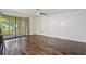 Living room with hardwood floors and a sliding glass door to a private balcony at 1872 Montclair Dr # C, Mount Pleasant, SC 29464
