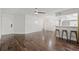 Living room with hardwood floors, views of the kitchen, and a door to the private balcony at 1872 Montclair Dr # C, Mount Pleasant, SC 29464