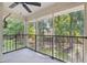 Relaxing screened porch with concrete flooring that overlooks green trees and beautiful landscaping at 1872 Montclair Dr # C, Mount Pleasant, SC 29464