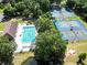 Aerial photo of pool and tennis courts in a community with a large wooded area at 19 Rudwick Cir, Goose Creek, SC 29445