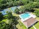 Aerial view showcasing community pool and tennis courts, a relaxing recreational spot at 19 Rudwick Cir, Goose Creek, SC 29445