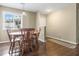 Charming dining room with a wooden table and chairs, bathed in natural light at 19 Rudwick Cir, Goose Creek, SC 29445