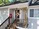 Inviting front door with a hanging flower basket and wooden stairs at 19 Rudwick Cir, Goose Creek, SC 29445