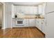 Well-lit kitchen with white cabinets, modern appliances, and a clean design at 19 Rudwick Cir, Goose Creek, SC 29445